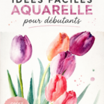 Des pinceaux et des couleurs aquarelles disposés sur une surface de travail, représentant le monde de l'art aquarelle.