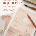 Des crayons aquarelle dans des teintes vibrantes disposés sur une table avec un carnet de croquis.