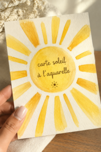 Carte soleil réalisée en aquarelle, avec des couleurs vibrantes et des détails délicats.