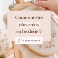 Une brodeuse concentrée sur son travail avec des fils colorés
